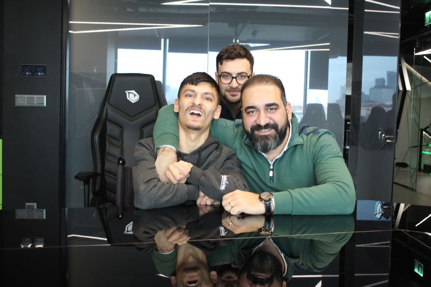 Ozgur Safak Okmek with teammates at the office